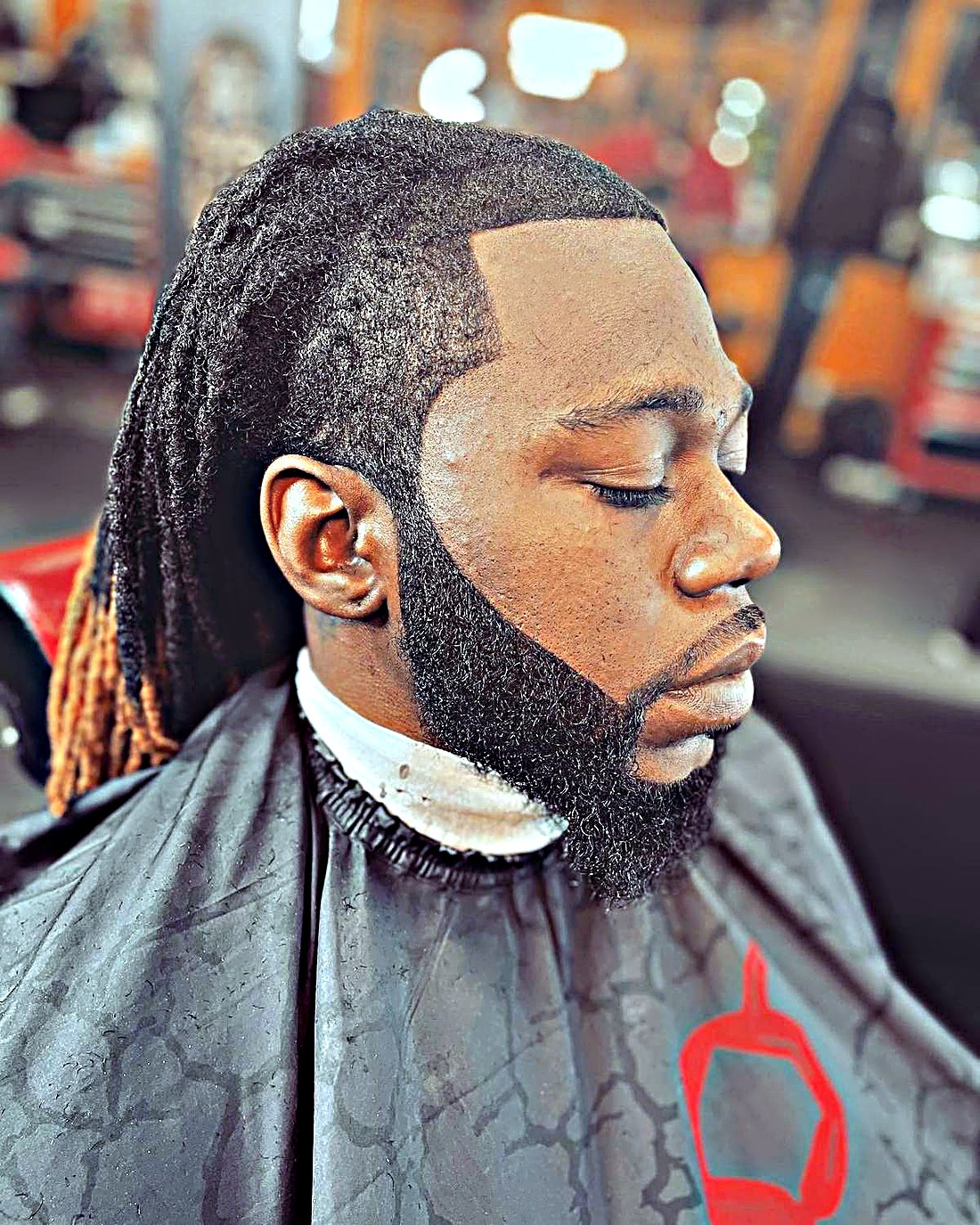 Long locs with sharp lineup and beard