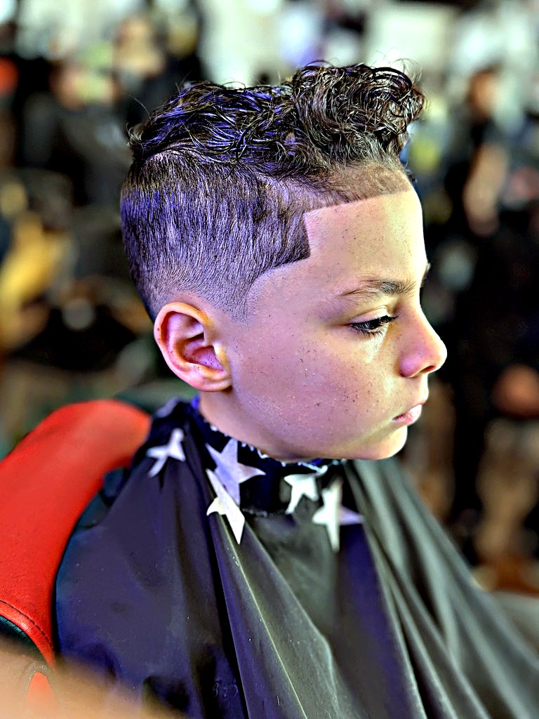 Curly top with skin fade and lineup